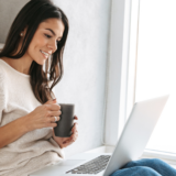 Holistic counselling Gold Coast – woman having online counselling session with cup of tea