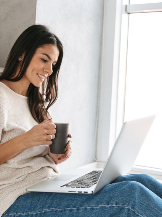 Holistic counselling Gold Coast – woman having online counselling session with cup of tea